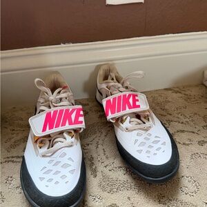 Nike Kids White and Pink tack throwing shoes